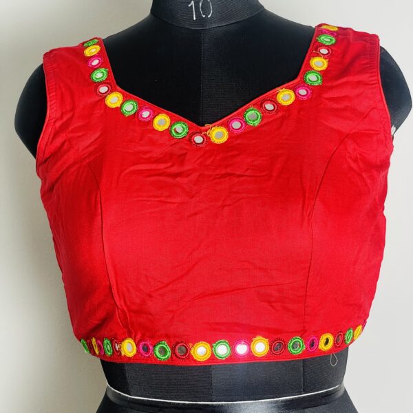 Red blouse with glass work on the neck