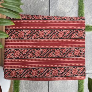 Red soft cotton running material with black and red ajarakh print