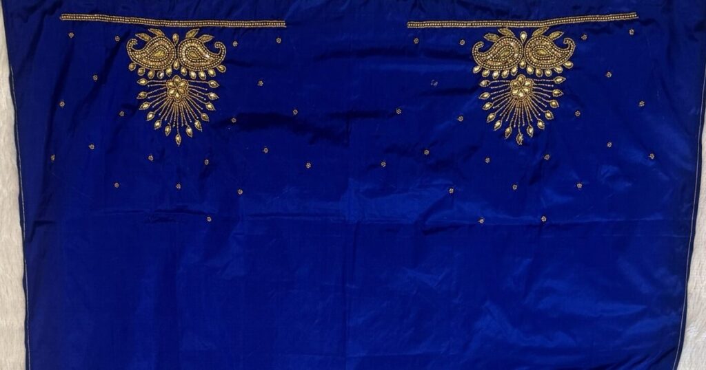 Royal blue raw silk blouse piece with hand aari work gold paisley motifs on both shoulders